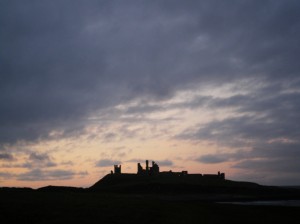 Dunstanburgh Castle at sunset